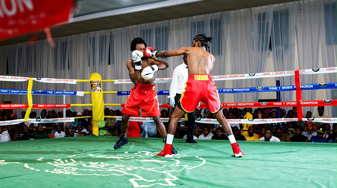 Two boxers trading punches in the ring under the lights